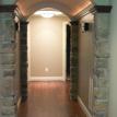 Barrel Ceiling Hallway with Cove Lighting & Sconces